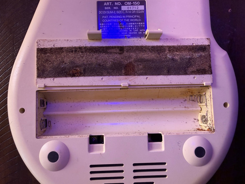 Actual battery compartment showing corrosion and residue