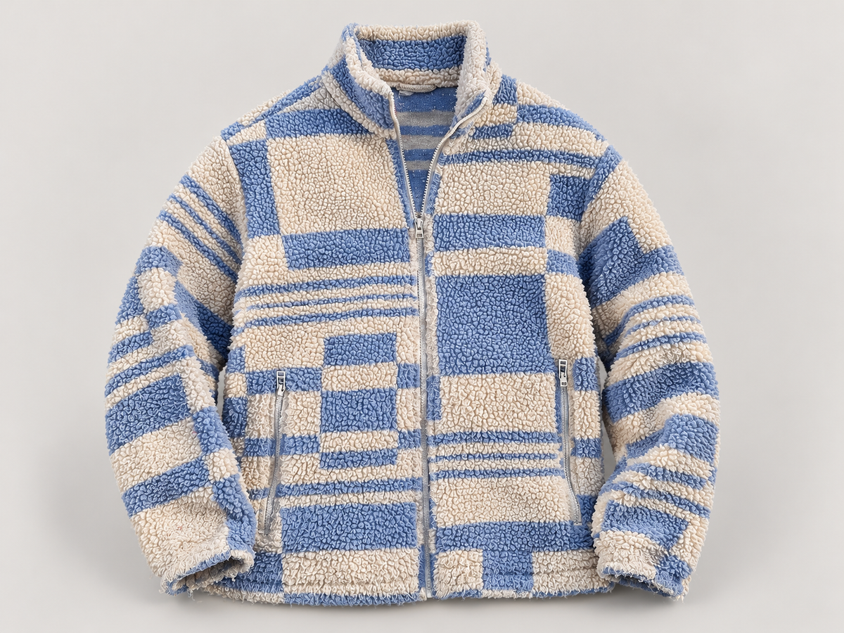 AI-edited studio view of blue & cream geometric sherpa jacket
